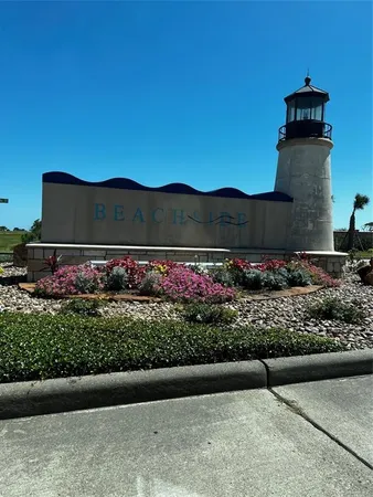 a view of a street with a bench in front of it