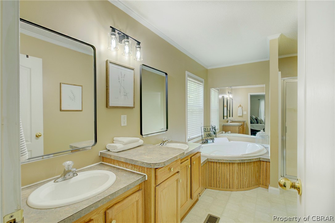 3246 Island Road Gloucester, VA 23061 - Photo 20 of 25 Bathroom featuring tile flooring, a bathing tub, and oversized vanity