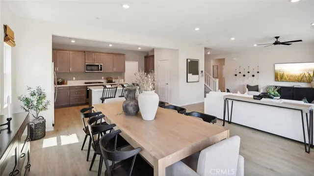 a large kitchen with a table and chairs in it