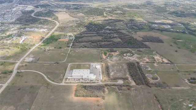 an aerial view of a houses with beach