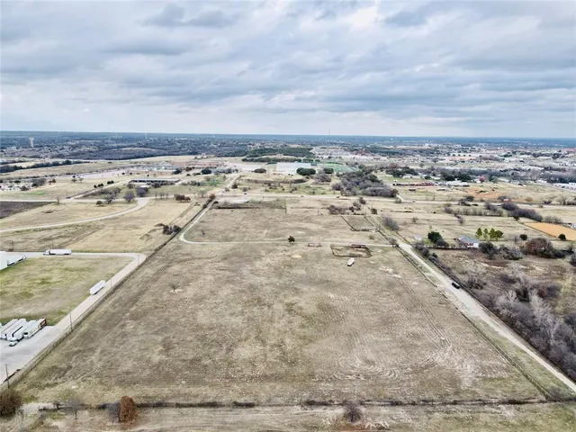 a view of a swimming pool and an outdoor seating