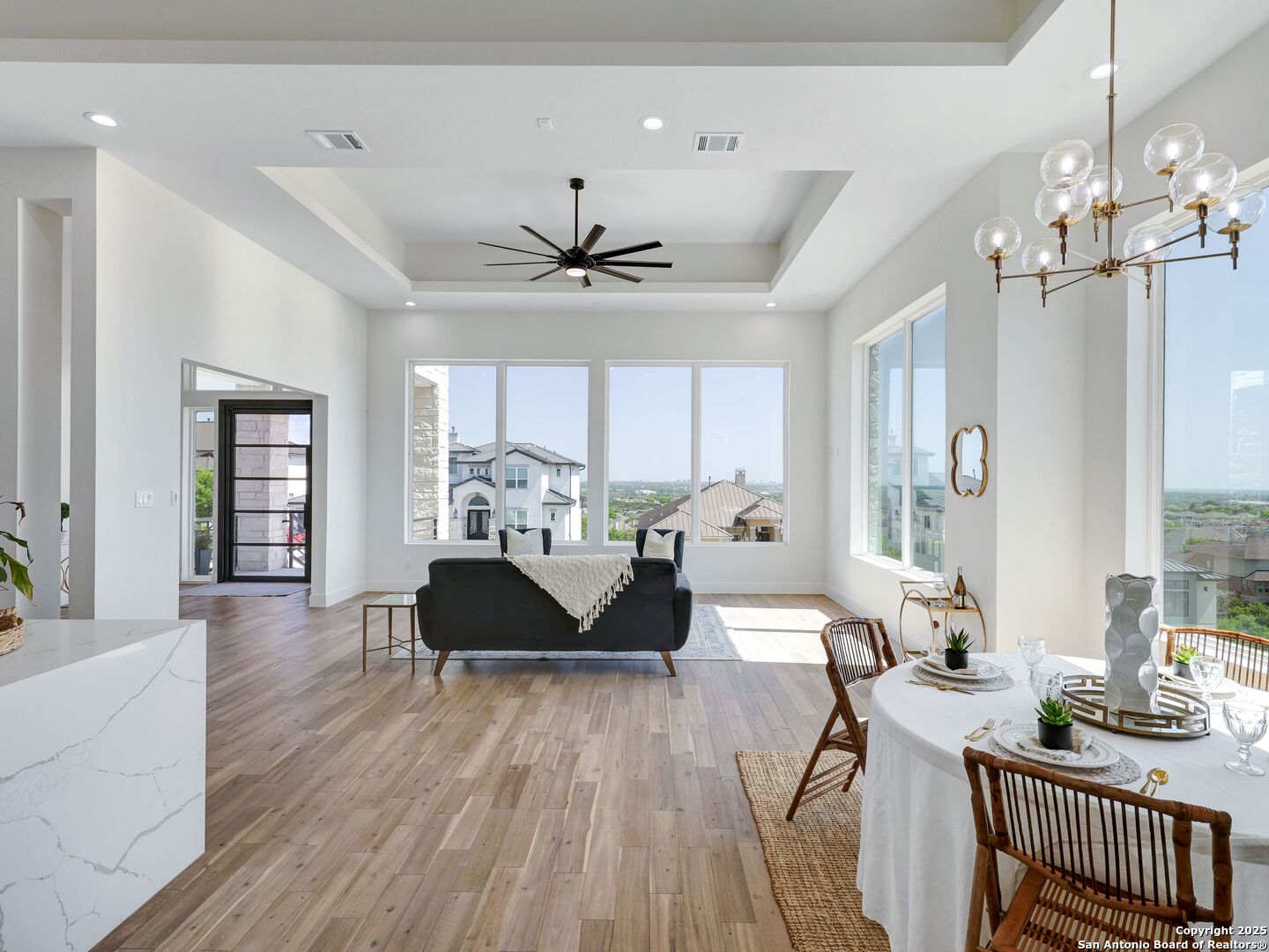 8214 Sierra Hermosa San Antonio, TX 78255 - Photo 11 of 61 a living room with furniture and a chandelier