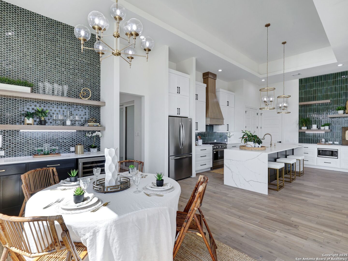 8214 Sierra Hermosa San Antonio, TX 78255 - Photo 13 of 61 a dining room with furniture a chandelier and wooden floor