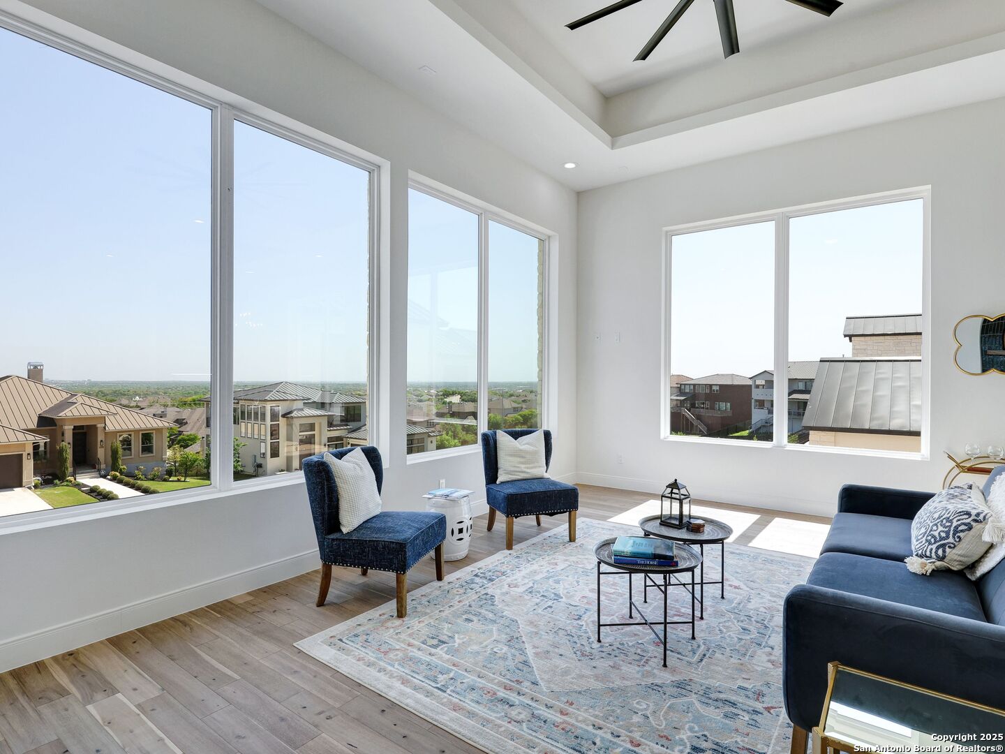 8214 Sierra Hermosa San Antonio, TX 78255 - Photo 15 of 61 a living room with furniture and a floor to ceiling window