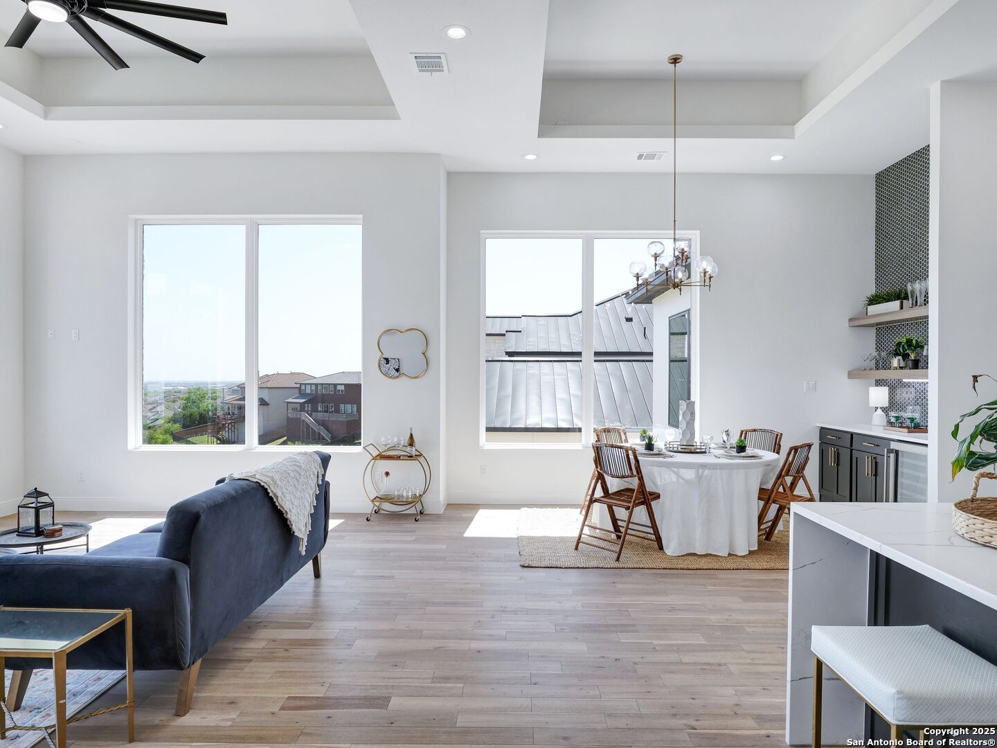 8214 Sierra Hermosa San Antonio, TX 78255 - Photo 31 of 61 a view of a dining room with furniture window and wooden floor