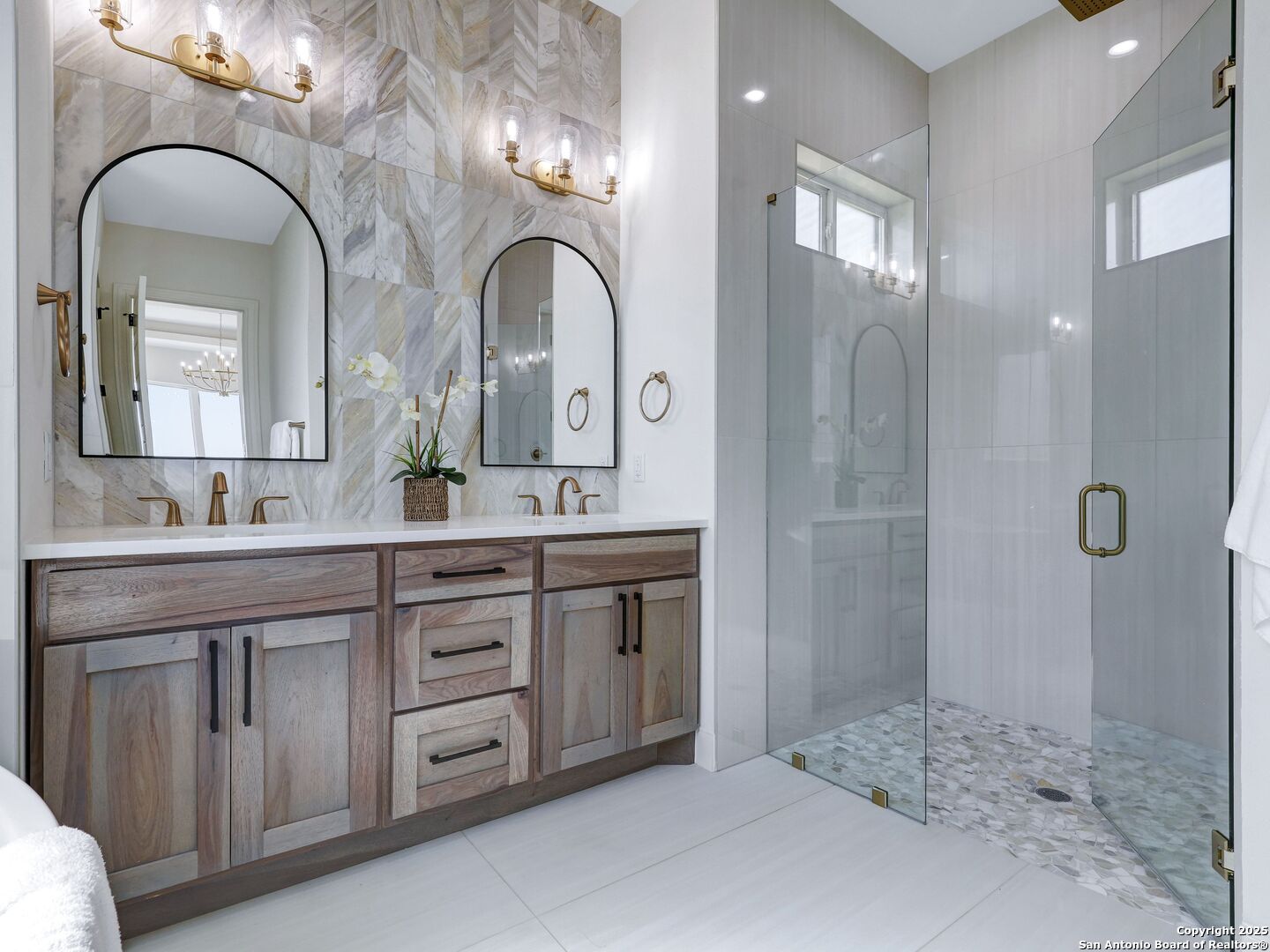 8214 Sierra Hermosa San Antonio, TX 78255 - Photo 37 of 61 a bathroom with a double vanity sink and mirror