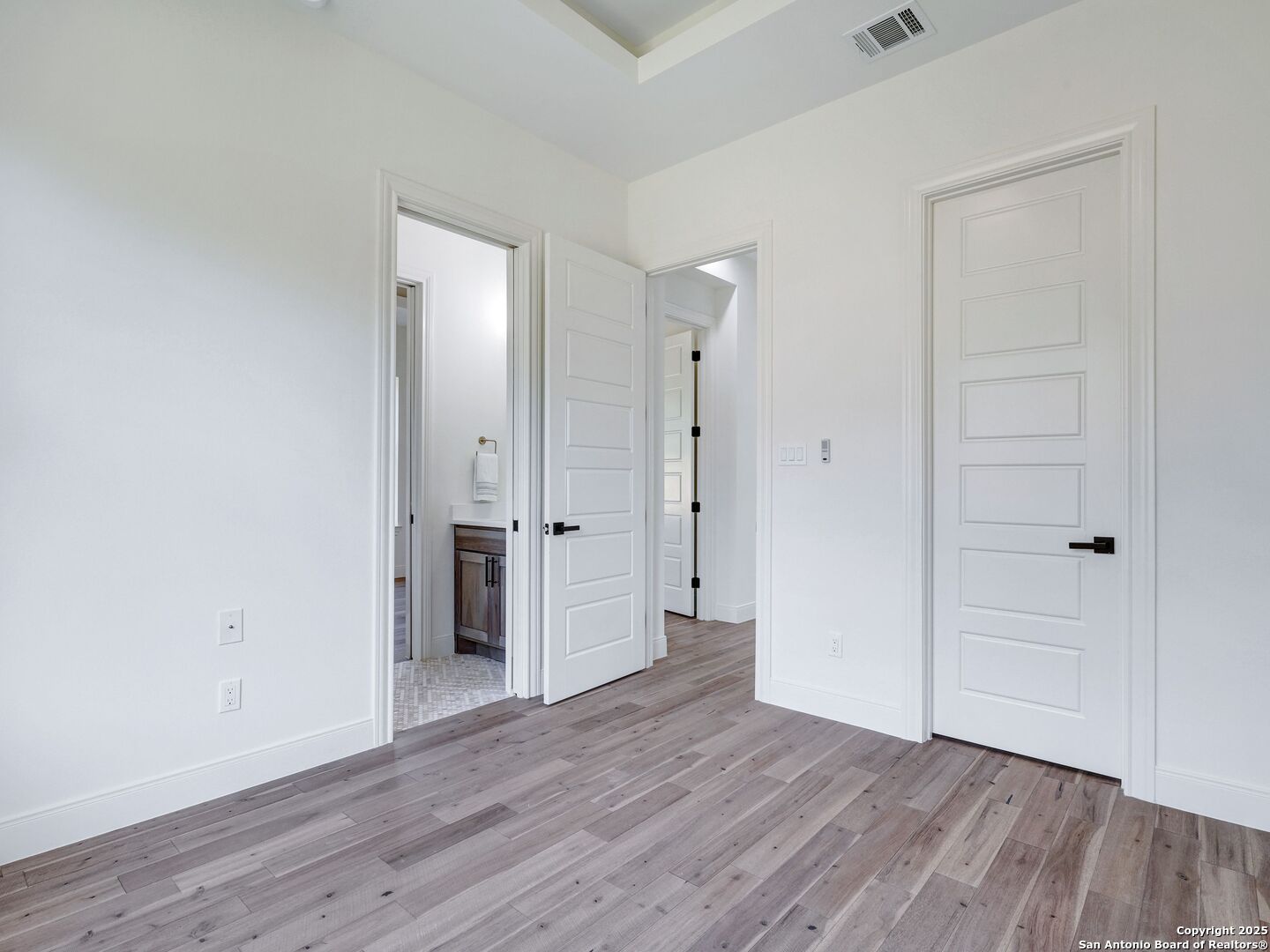 8214 Sierra Hermosa San Antonio, TX 78255 - Photo 42 of 61 a view of a hallway with wooden floor and closet area