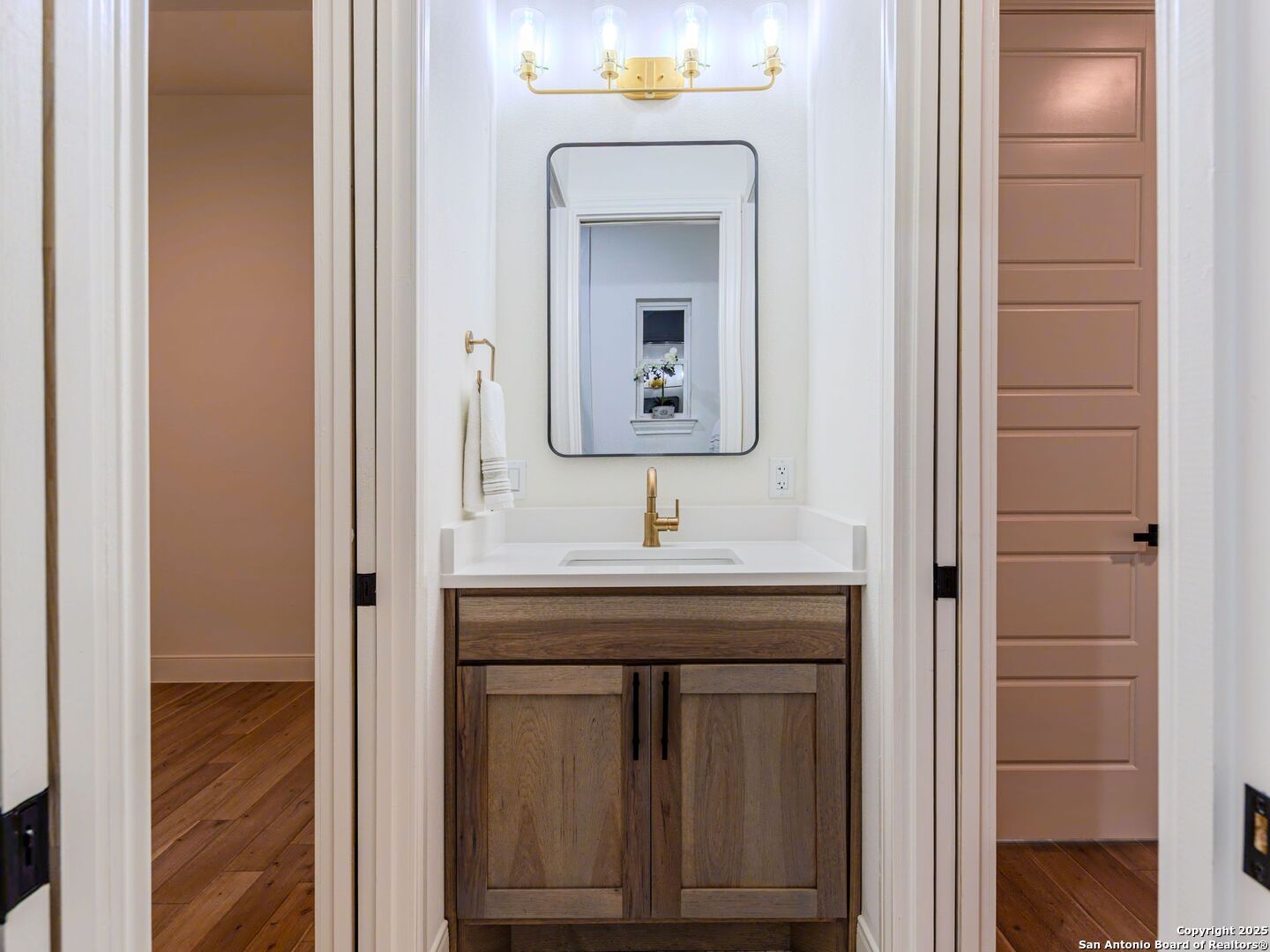 8214 Sierra Hermosa San Antonio, TX 78255 - Photo 46 of 61 a bathroom with a sink and a mirror