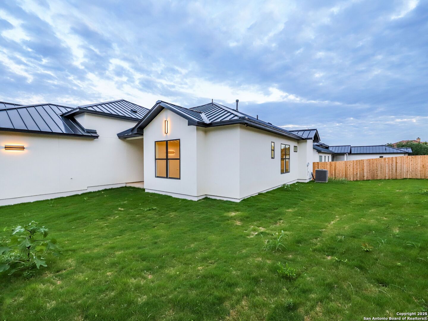 8214 Sierra Hermosa San Antonio, TX 78255 - Photo 54 of 61 a backyard of a house with lots of green space and garden