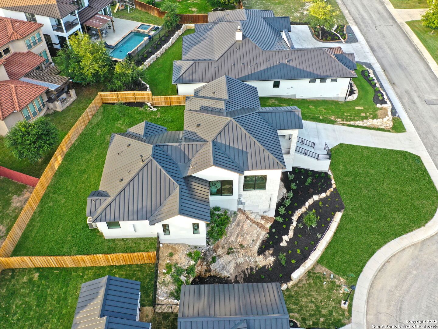 8214 Sierra Hermosa San Antonio, TX 78255 - Photo 57 of 61 an aerial view of multiple houses with a yard