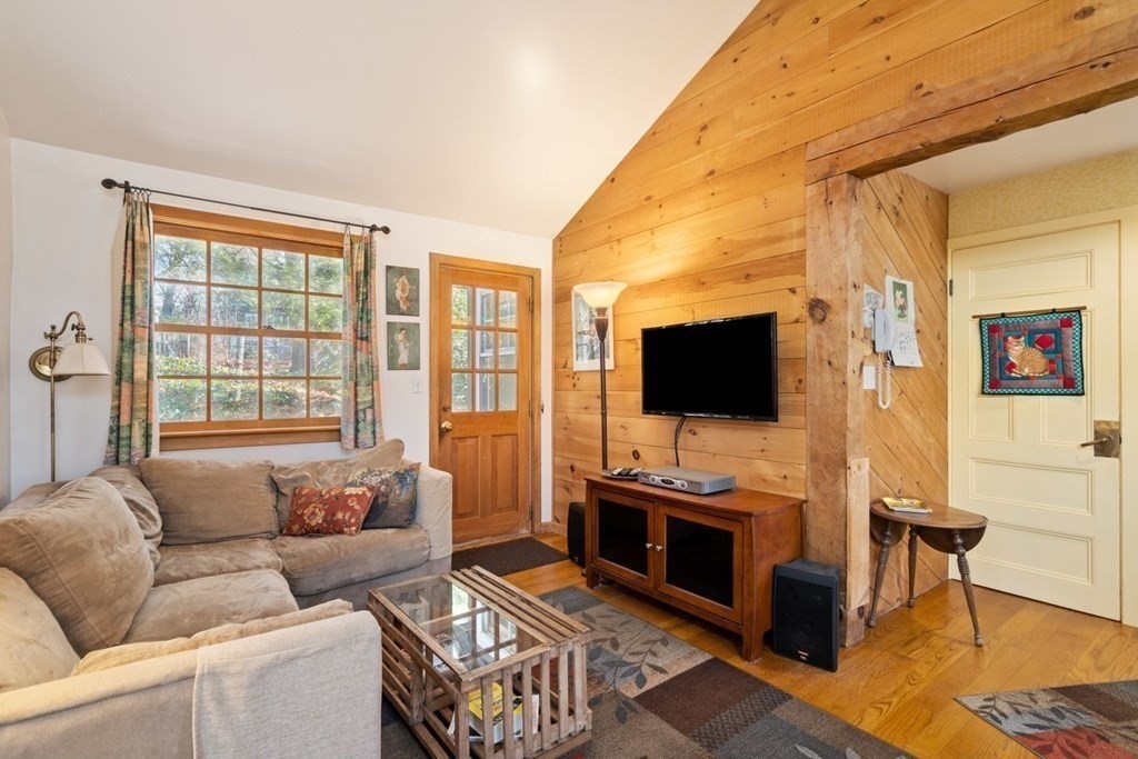 54 Manchester Road Newton, MA 02461 - Photo 17 of 40 a living room with furniture and a flat screen tv