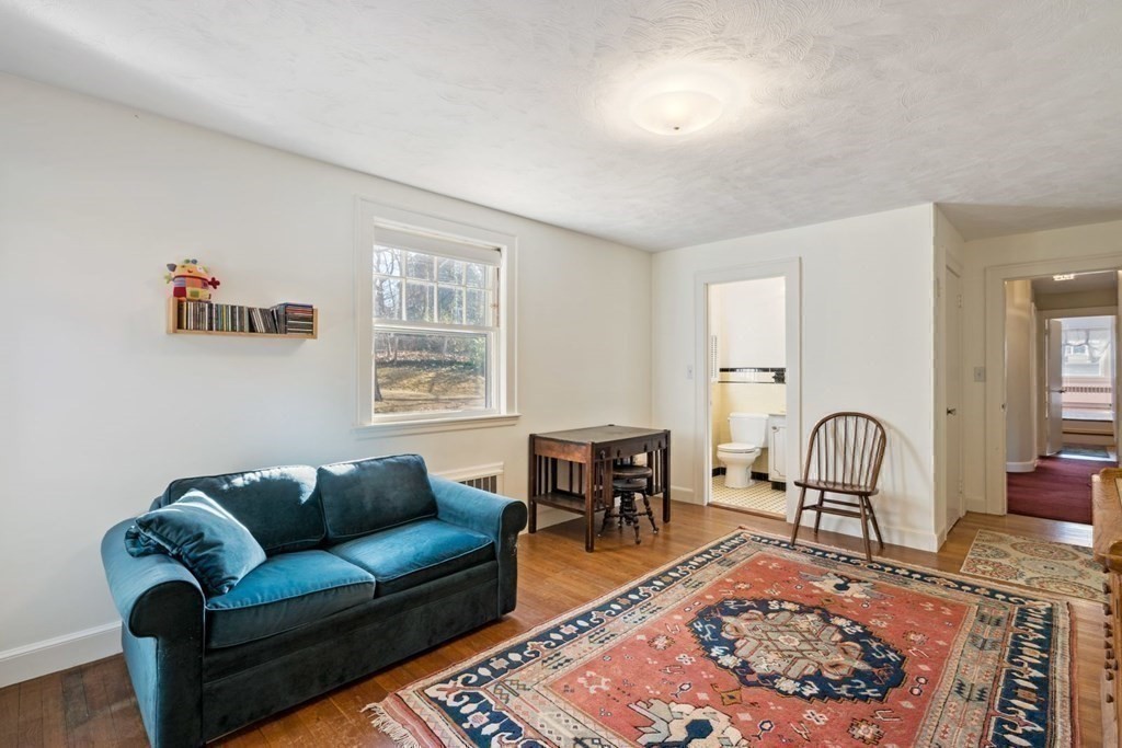 54 Manchester Road Newton, MA 02461 - Photo 19 of 40 a living room with furniture a rug and a window