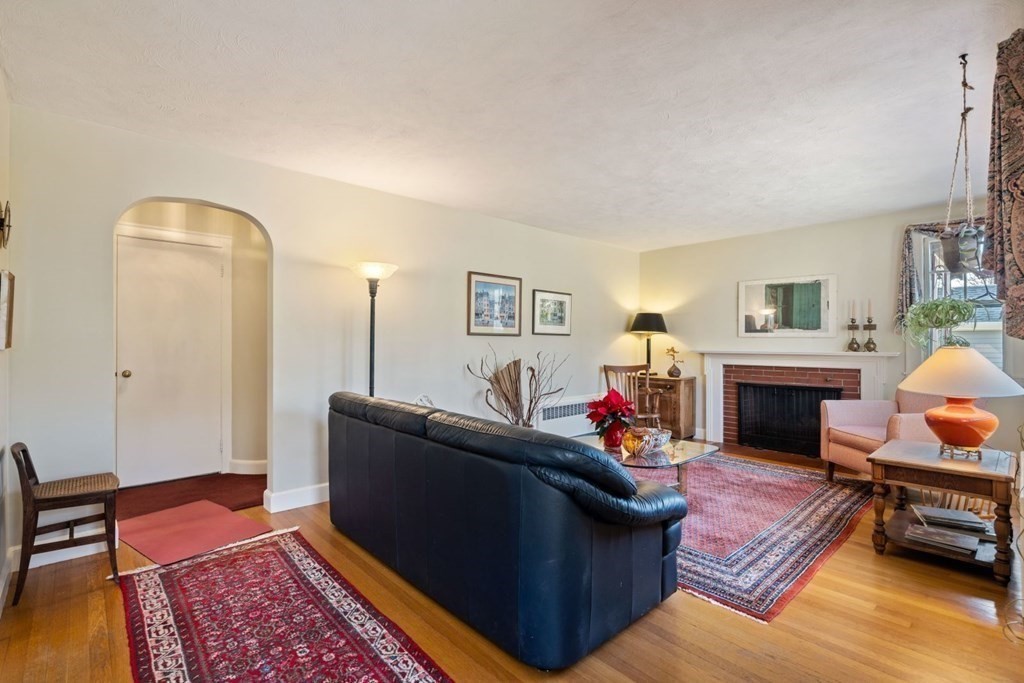 54 Manchester Road Newton, MA 02461 - Photo 2 of 40 a living room with furniture a fireplace and a window