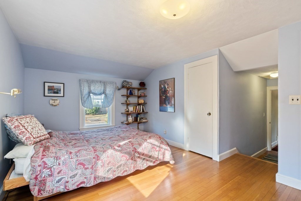 54 Manchester Road Newton, MA 02461 - Photo 23 of 40 a bedroom with a large bed and a window
