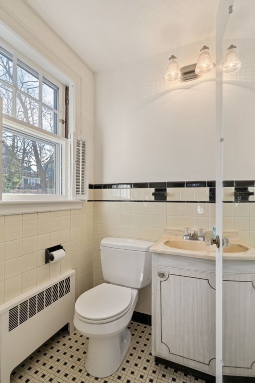 54 Manchester Road Newton, MA 02461 - Photo 25 of 40 a white toilet sitting next to a bathroom sink