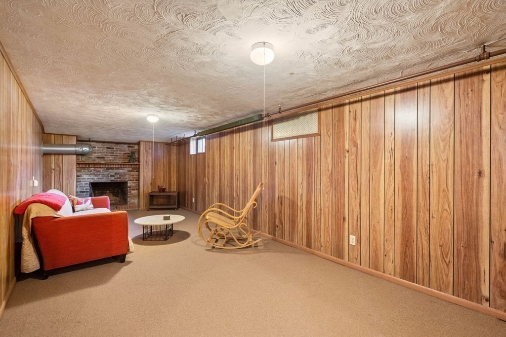 54 Manchester Road Newton, MA 02461 - Photo 26 of 40 a view of a livingroom with furniture and a fireplace
