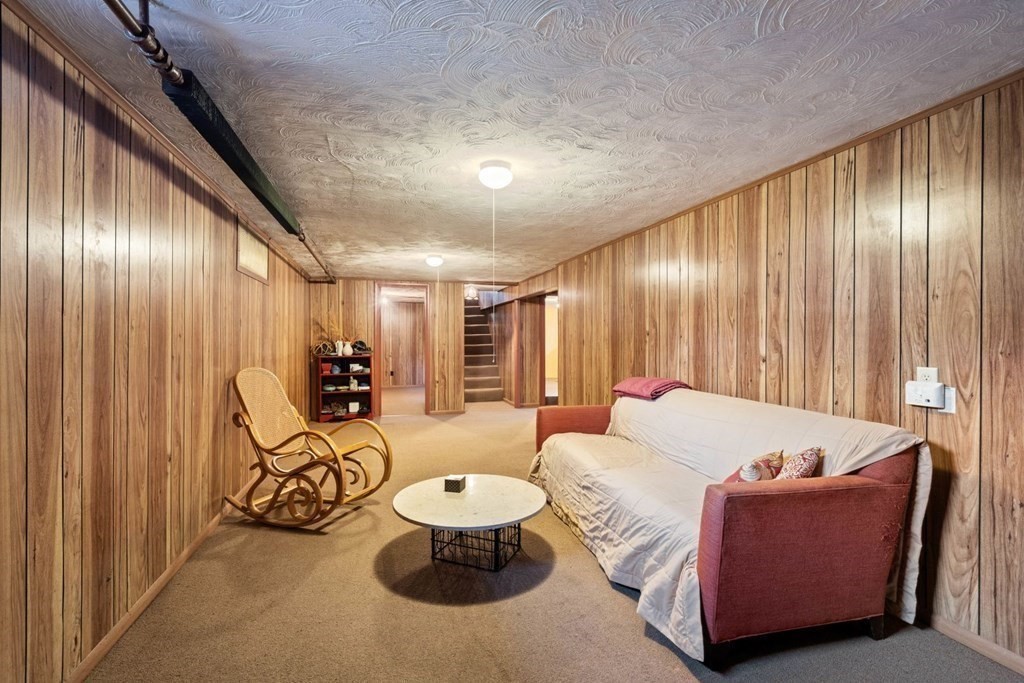 54 Manchester Road Newton, MA 02461 - Photo 28 of 40 a living room with furniture and large windows