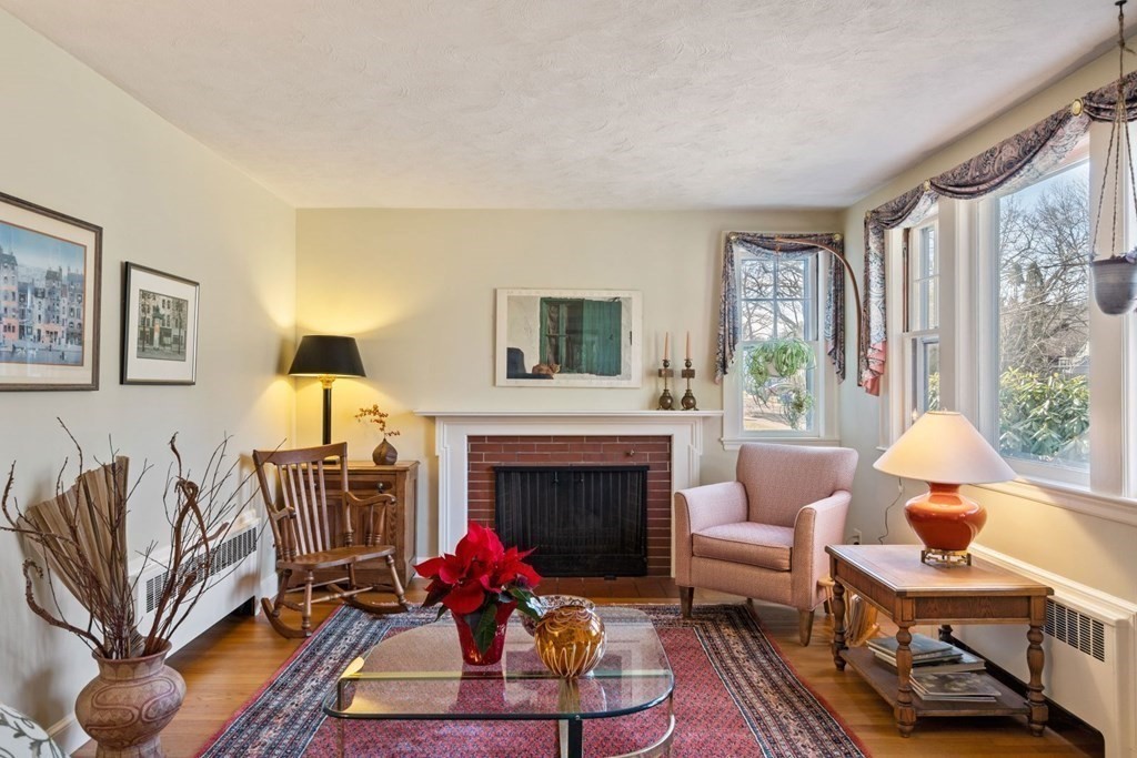 54 Manchester Road Newton, MA 02461 - Photo 3 of 40 a living room with furniture a window and a fireplace