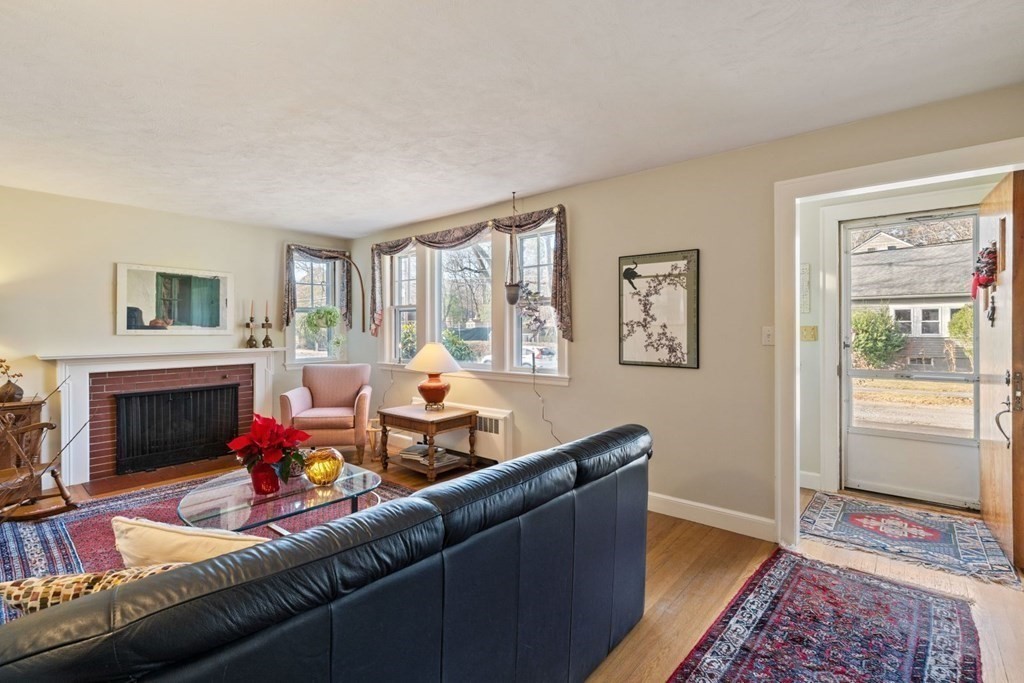 54 Manchester Road Newton, MA 02461 - Photo 4 of 40 a living room with furniture and a fireplace