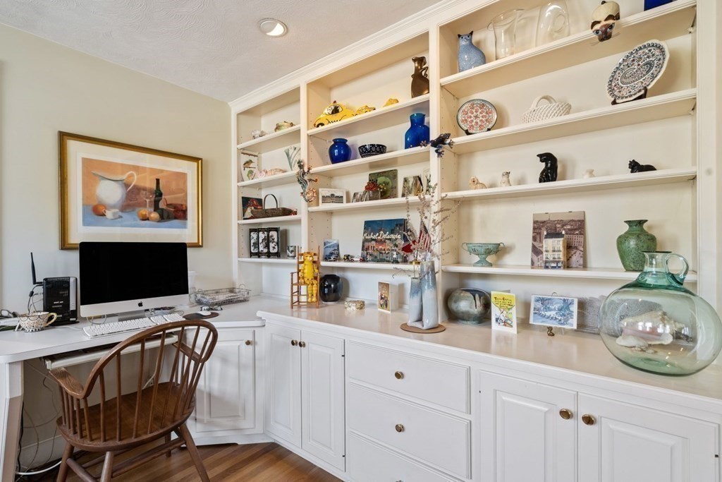 54 Manchester Road Newton, MA 02461 - Photo 6 of 40 a workspace with furniture and wooden floor