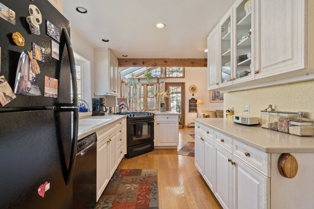 54 Manchester Road Newton, MA 02461 - Photo 9 of 40 a kitchen with counter top space and appliances
