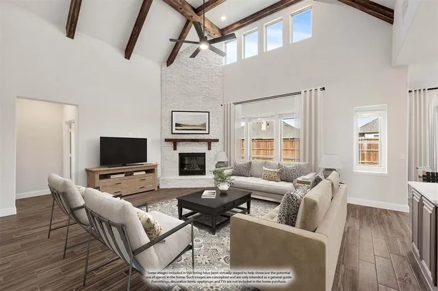 a living room with furniture wooden floor and a flat screen tv