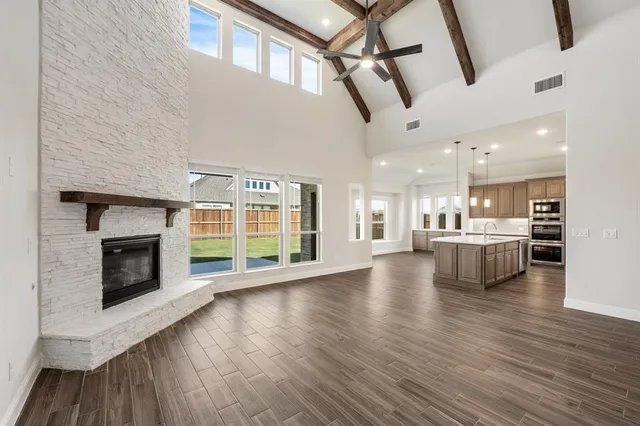 a view of a living room with furniture and a fireplace