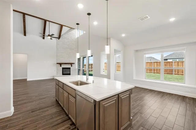 a kitchen with a sink and stove