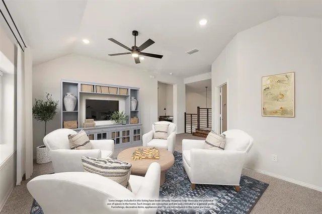 a living room with furniture and a rug