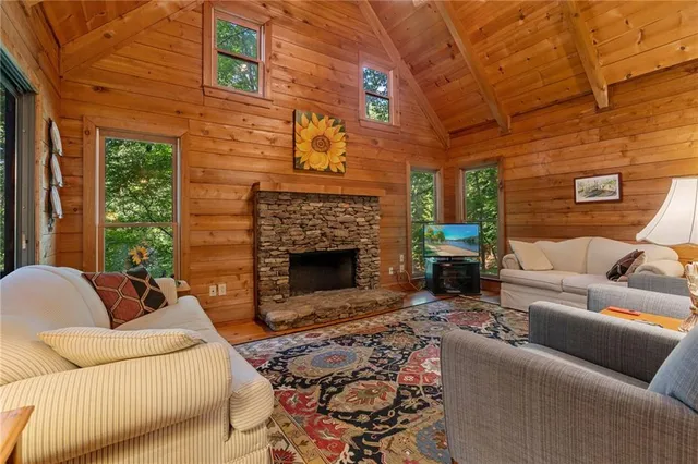 a living room with furniture windows and a fireplace