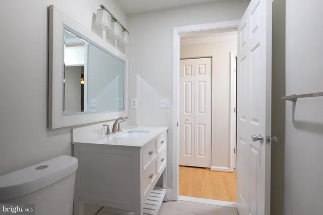 a bathroom with a sink and vanity