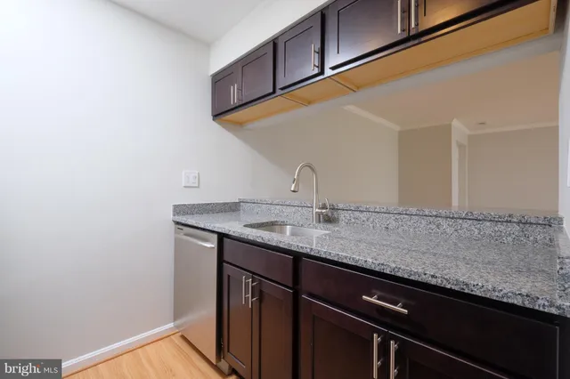 a view of an empty room with a fireplace