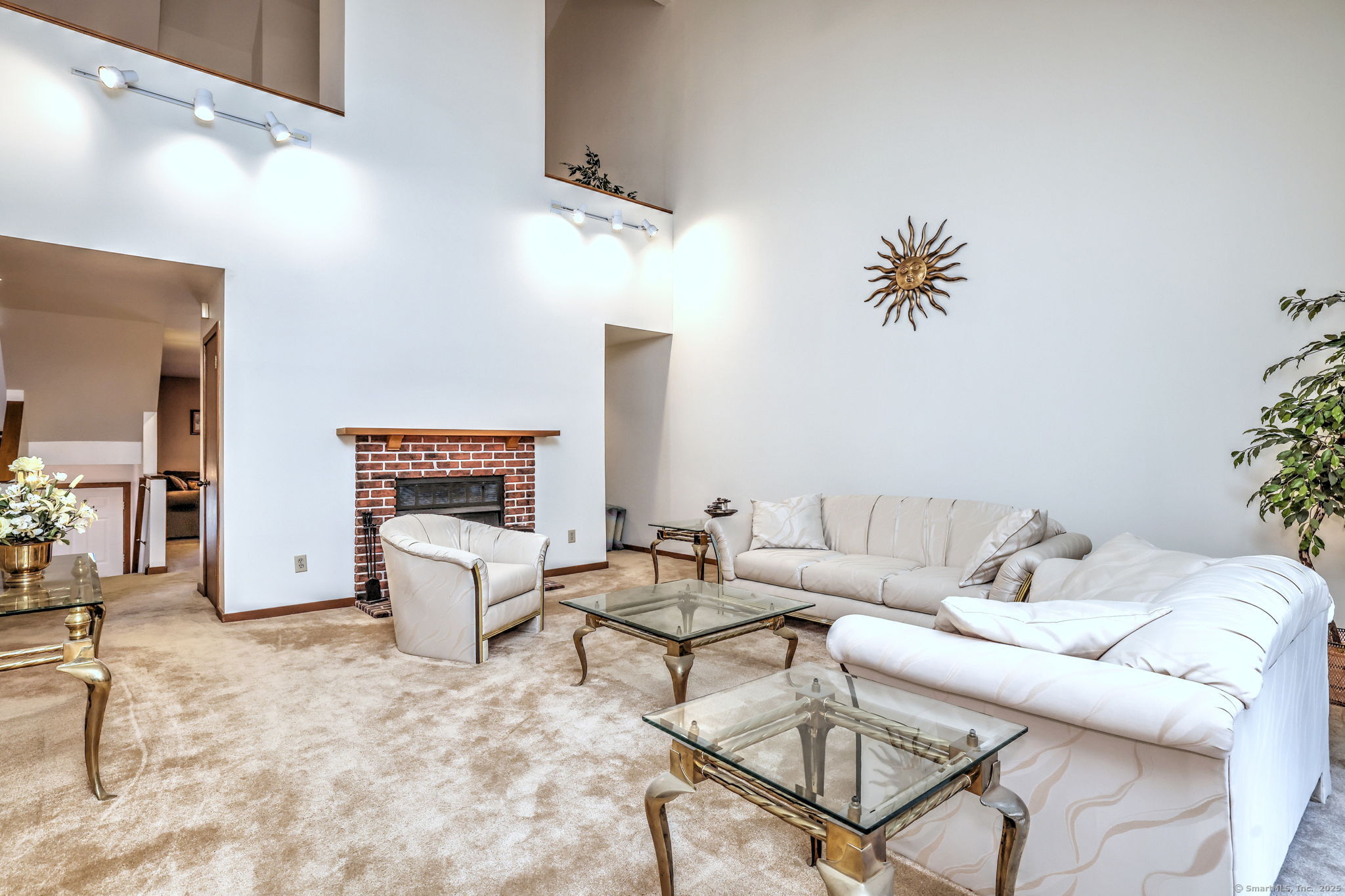 690 Forest Road, Unit 702 West Haven, CT 06516 - Photo 11 of 40 a living room with furniture and a fireplace