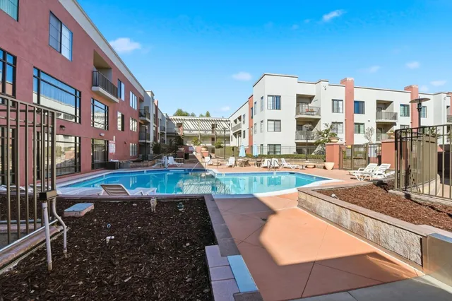 a view of a balcony with outdoor seating
