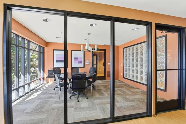 a living room with fireplace furniture and a window