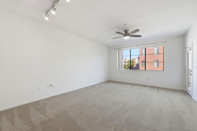 a kitchen with granite countertop a stove and a sink