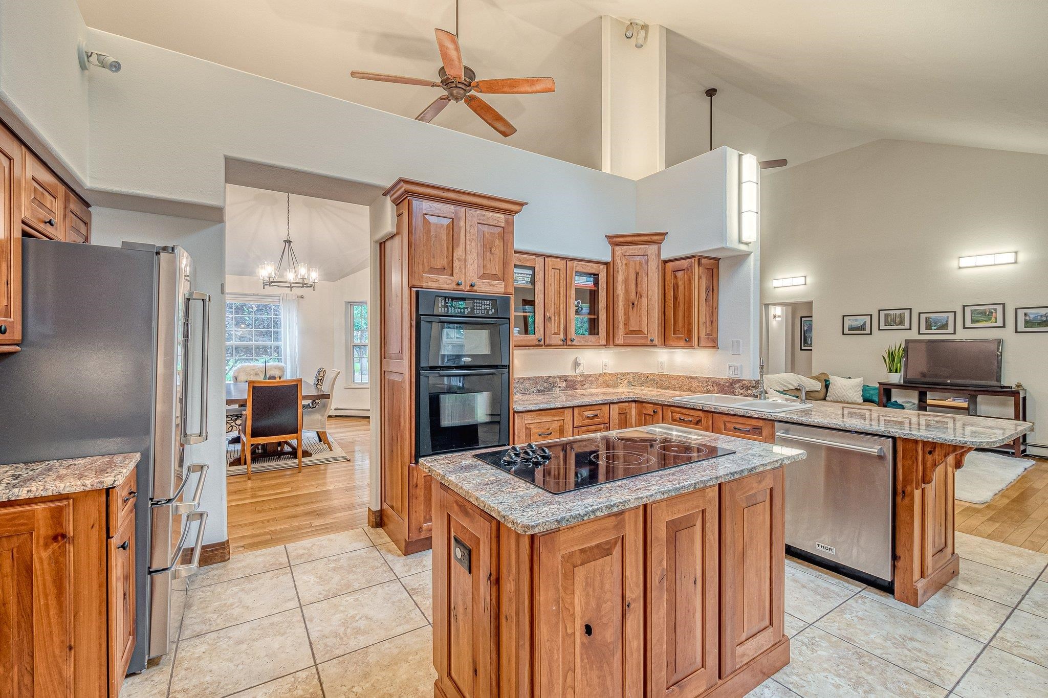 2321 South Rim Drive Grand Junction, CO 81507 - Photo 16 of 41 a kitchen that has a lot of cabinets a sink and appliances in it