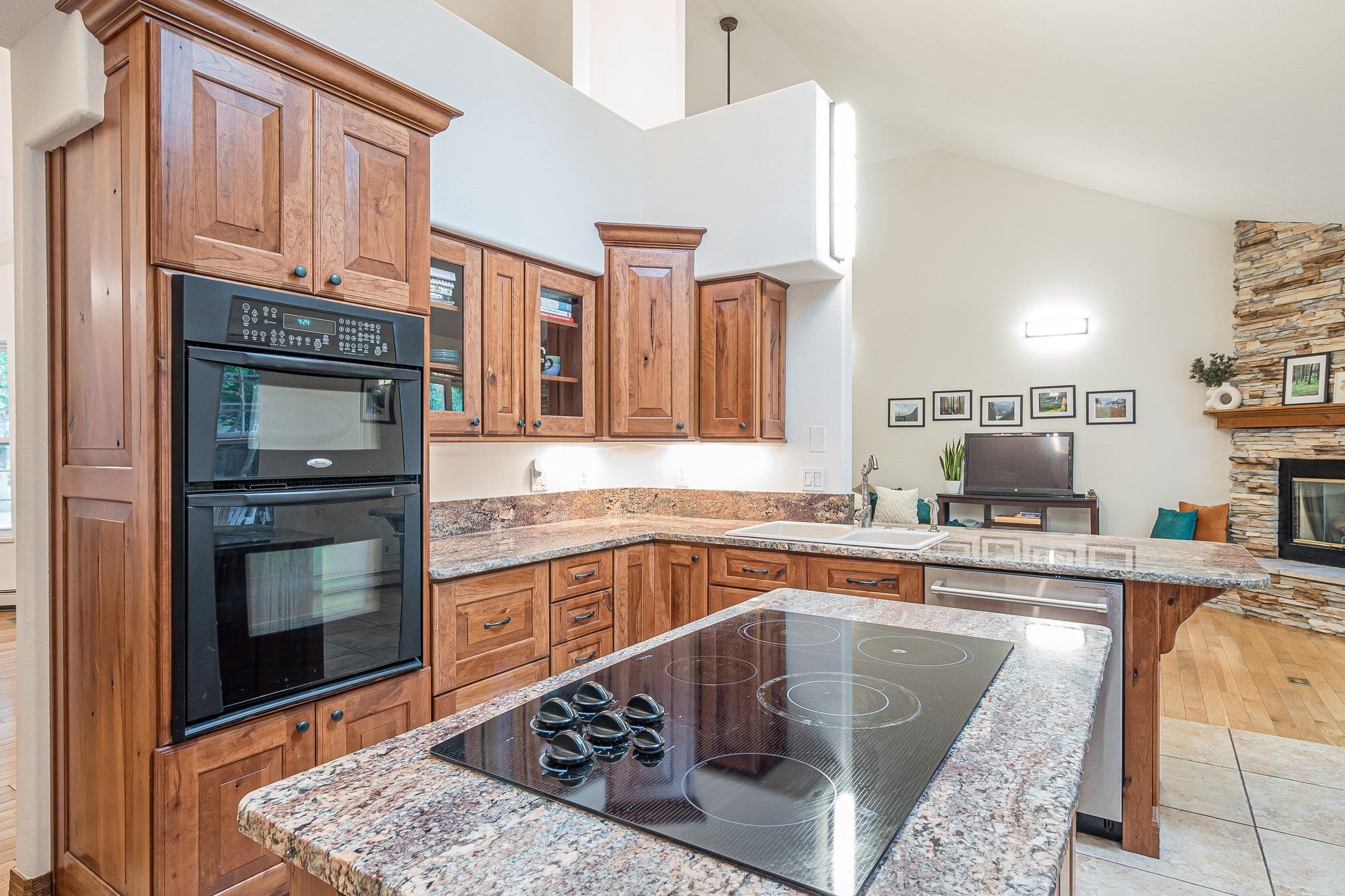 2321 South Rim Drive Grand Junction, CO 81507 - Photo 18 of 41 a kitchen with stainless steel appliances granite countertop a sink stove and cabinets