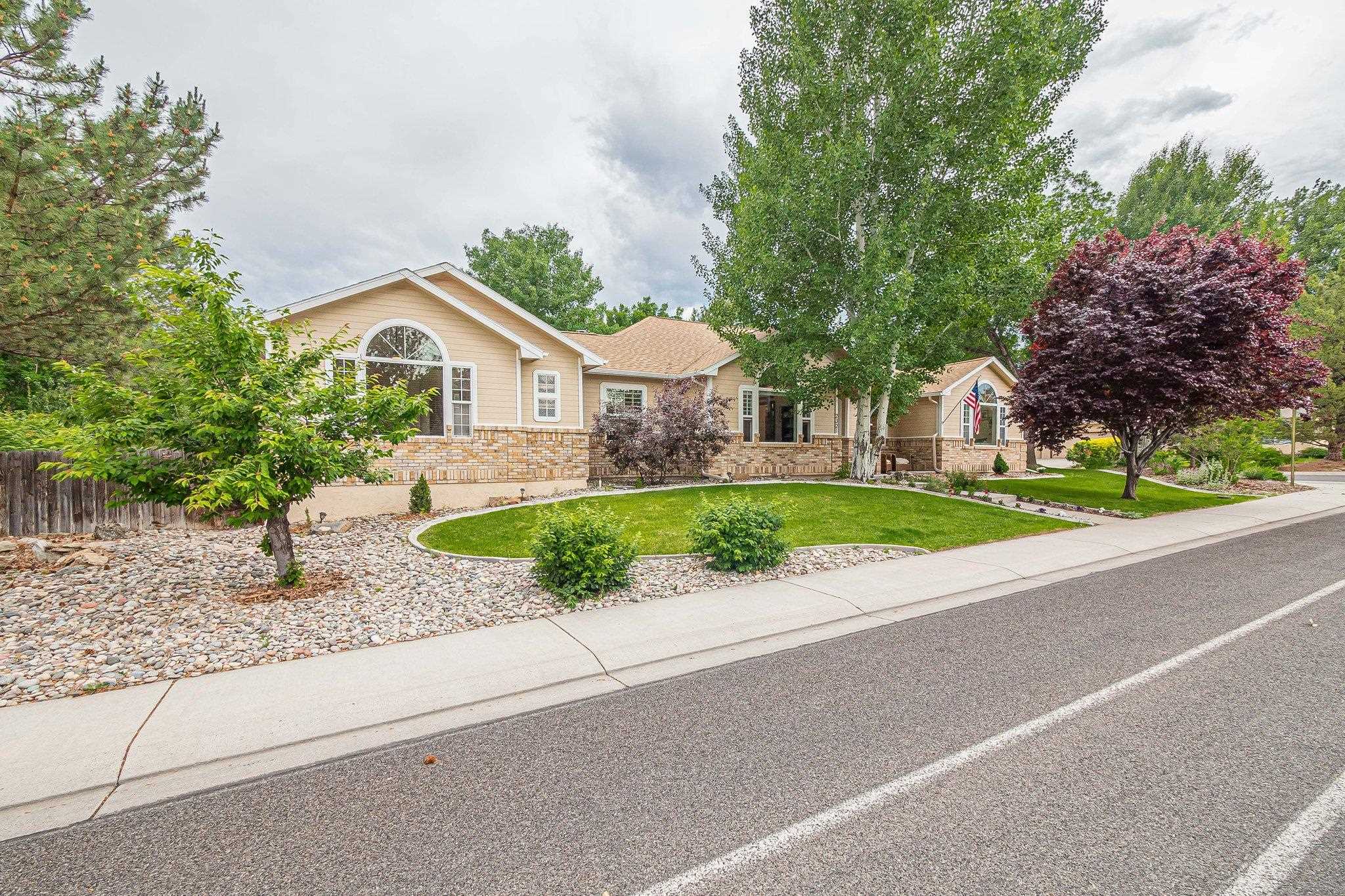 2321 South Rim Drive Grand Junction, CO 81507 - Photo 2 of 41 a front view of house with yard and green space