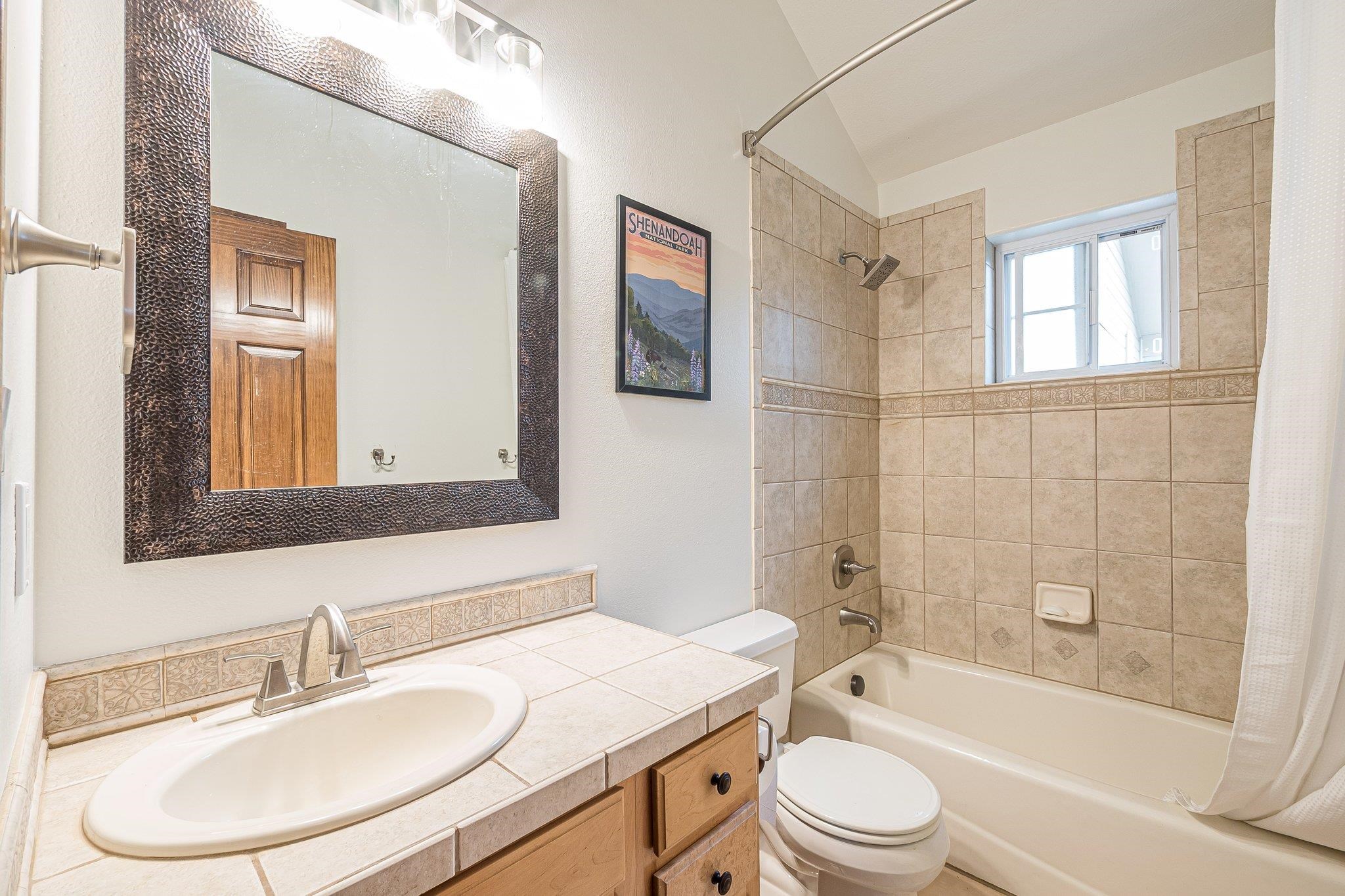2321 South Rim Drive Grand Junction, CO 81507 - Photo 24 of 41 a bathroom with a sink toilet and shower