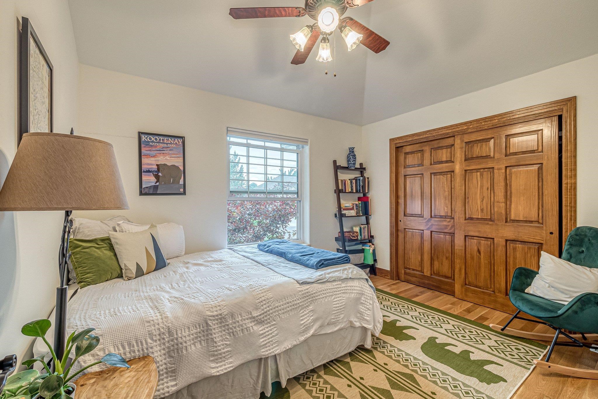 2321 South Rim Drive Grand Junction, CO 81507 - Photo 26 of 41 a bedroom with a bed and a chandelier