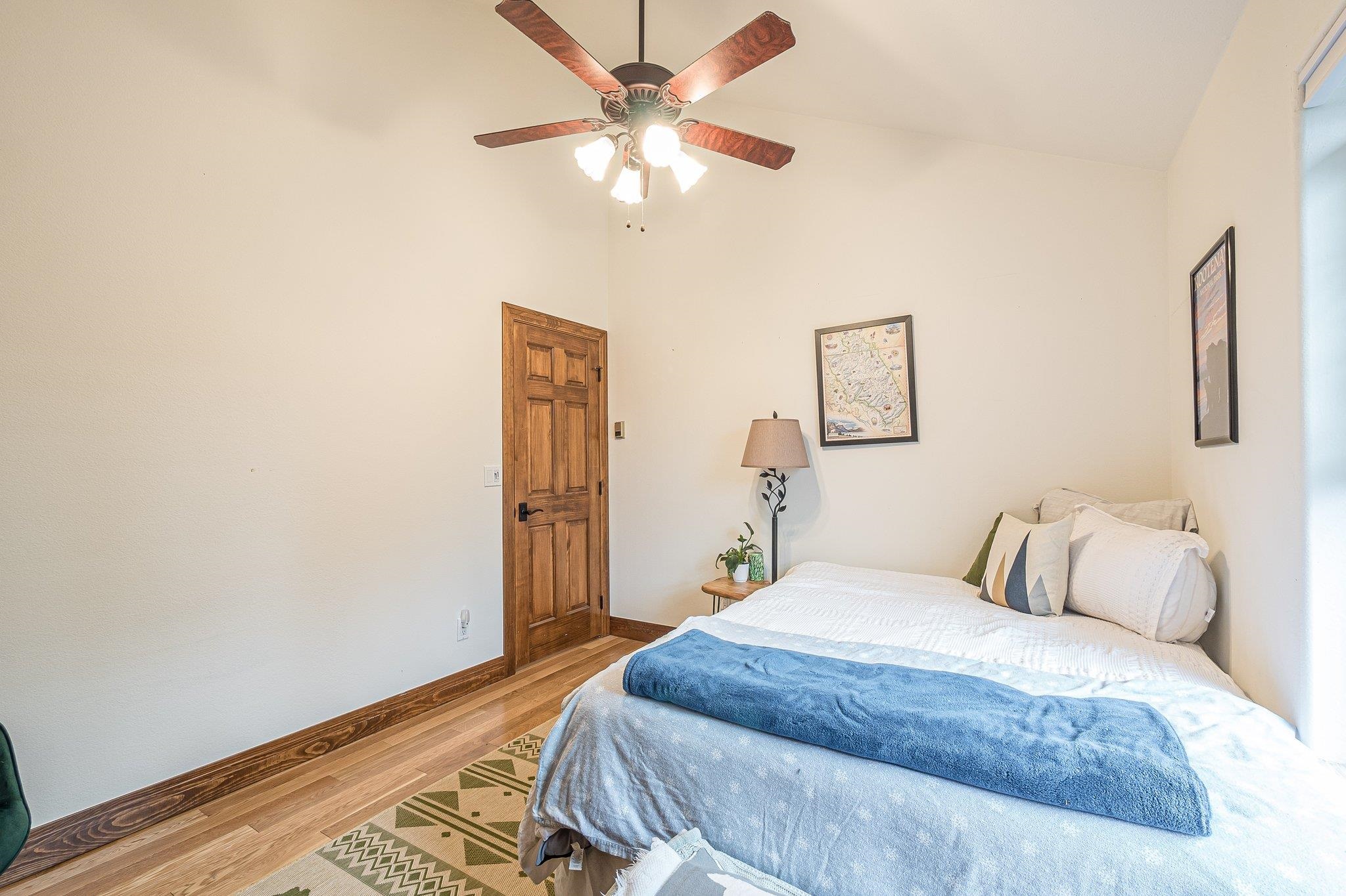 2321 South Rim Drive Grand Junction, CO 81507 - Photo 27 of 41 a bedroom with a bed and a chandelier