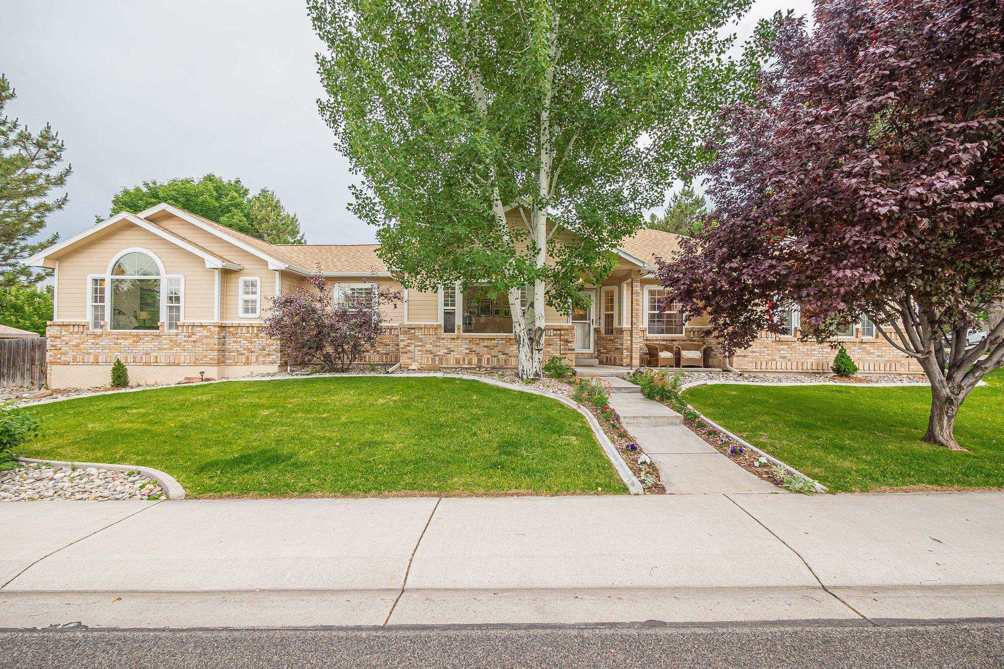 2321 South Rim Drive Grand Junction, CO 81507 - Photo 3 of 41 a view of a yard in front of a house