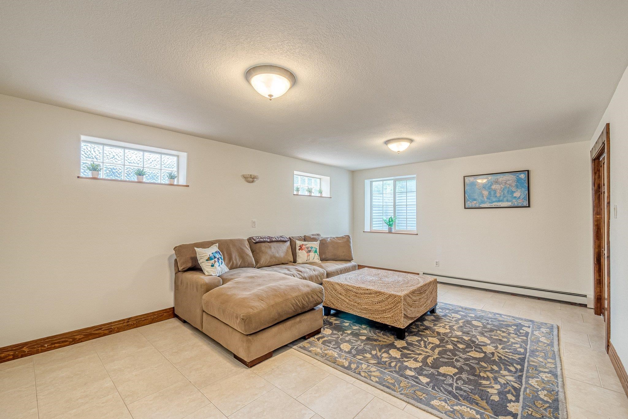 2321 South Rim Drive Grand Junction, CO 81507 - Photo 31 of 41 a living room with a couch and a rug
