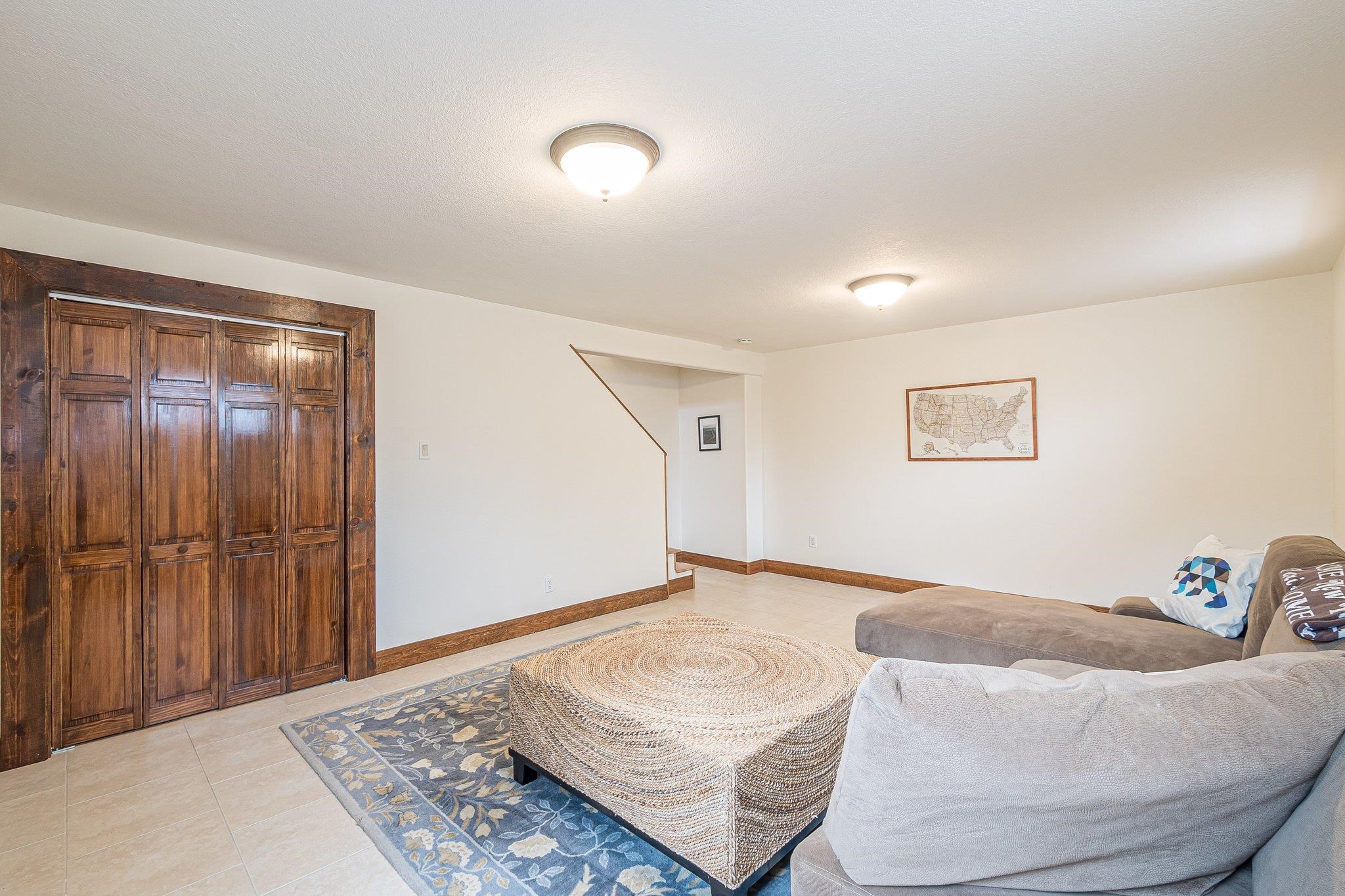 2321 South Rim Drive Grand Junction, CO 81507 - Photo 33 of 41 a living room with furniture and a rug