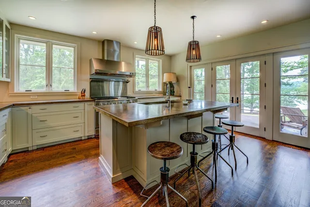 a bedroom with two beds and a chandelier