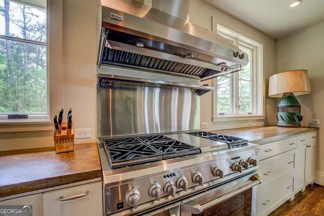 a white toilet sitting next to a bath tub