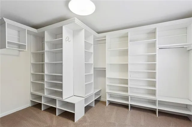 a view of an empty room with empty shelves