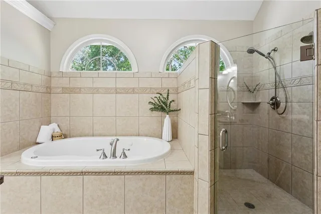 a bathroom with a tub and window