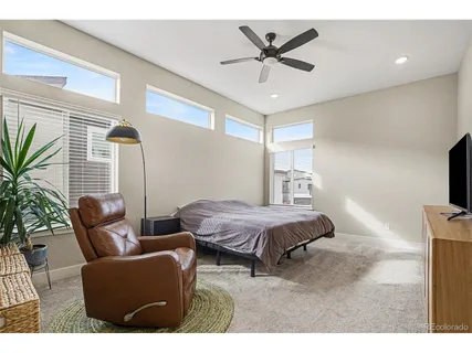 a bedroom with furniture and window